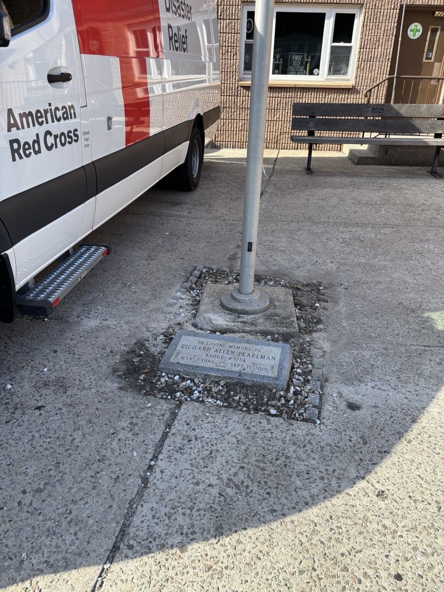 Richie Pearlman's memorial stone at the foot of the flagpole outside the FHVAC base